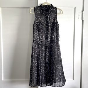 Greylin small sleeveless black and white patterned dress with pleated skirt